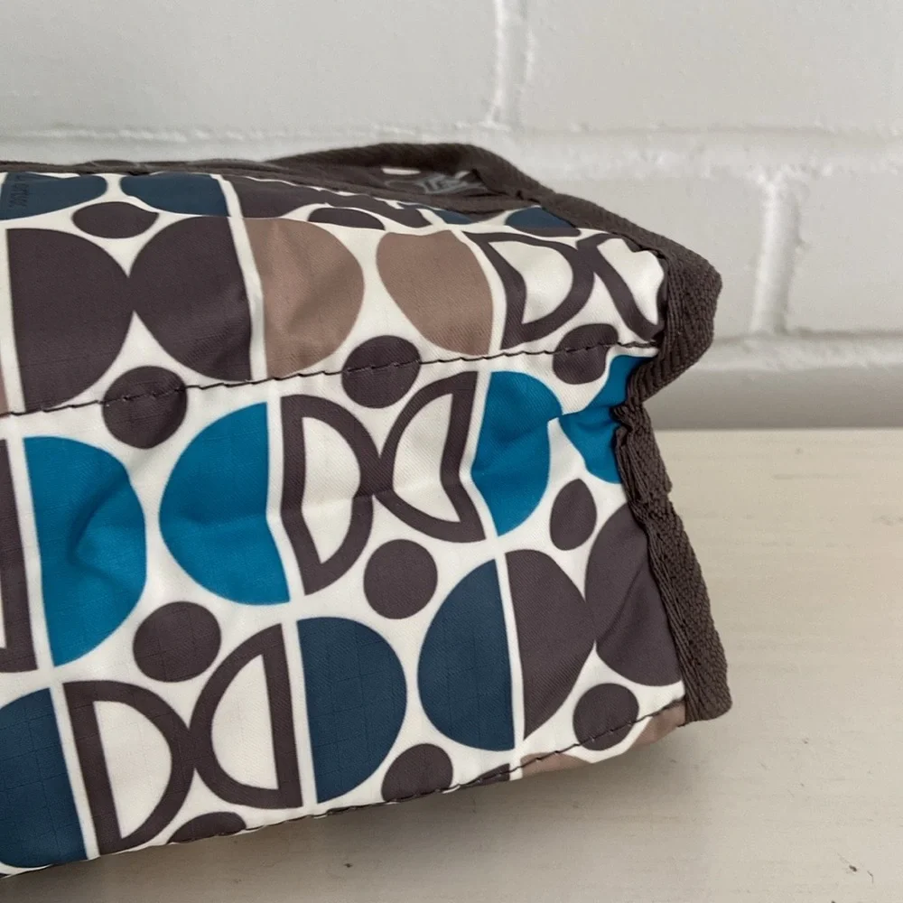 New With Tags LeSportsac Blue/Brown Patterned Cosmetic Travel Overnight Pouch